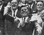 President Kennedy tossing a baseball to begin the 1963 season with Senator Humphrey and Senator Mansfield, April 8, 1963
