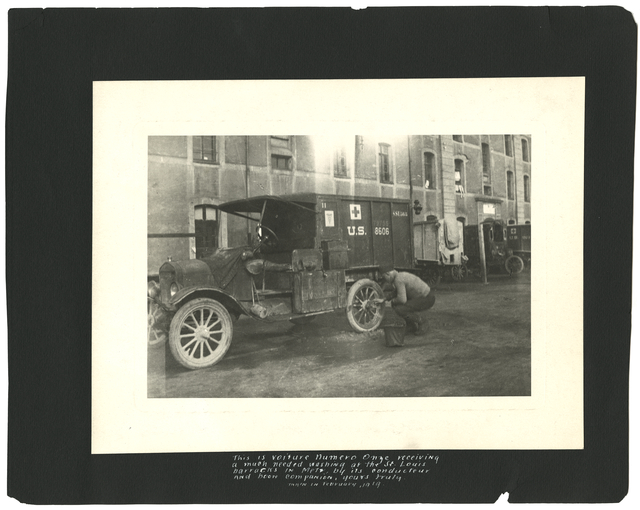 Guybert Phillips washing his ambulance at the St. Louis barracks in Metz, France, 1919