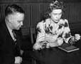 Chester A. Swanson timing Dorothy Mandel in an aptitude test for defense training, circa 1940