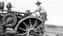 Julius Richter on a tractor breaking sod, Veteransville, 1922