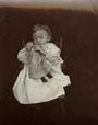 Janet Reynolds holding a doll, circa 1900