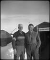 Two men outside foreman's barrackes, Thule Air Force Base, Greenland