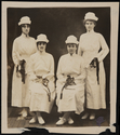 Four nurses holding diplomas