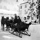 Claudette Colbert and Jerome Hill, riding in sleigh with friends in St. Anton, Switzerland