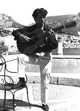 Man playing guitar at 1966 Cassis Festival