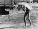 Man cooling off with water from a supply truck at 1966 Cassis Festival