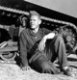 Jerome Hill, seated by vehicle, La Mesa, California, 1941-1942